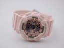 Angled top-down view of the pink G-SHOCK dial and case, highlighting the rose gold elements.
