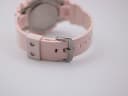 View of the pink rubber strap and steel pin buckle from the rear, showing strap holes.
