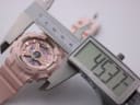 Digital caliper measuring the case diameter of the pink G-SHOCK watch, displaying 45.37mm.