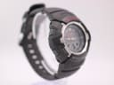 Angled side view of the G-Shock GW-1500A showing the left side of the black resin case with 'adjust' and 'mode' buttons.