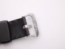 Close-up of the stainless steel buckle, engraved with 'CASIO THAILAND', and the end of the black rubber strap.