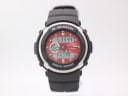 Front view of Casio G-Shock G-300 watch with black resin case and red ana-digi dial showing time 5:33:44 and day 'MON'.