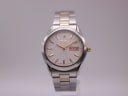 Front view of the Seiko 7N43-9070 watch with white dial, gold baton indices, and two-tone stainless steel bracelet on a grey background.