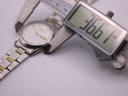 Digital caliper display showing a precise measurement of 36.5mm across the case of the Seiko watch.