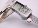 Digital caliper measuring the case width of the watch, displaying a reading of 12.63mm.