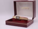 The Rotary watch nestled inside its original dark red presentation box with gold branding.