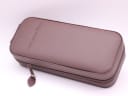 Closed view of the brown Constantin Weisz branded zipped travel case, made of leatherette material.