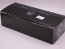 Black cardboard Constantin Weisz brand box with the company logo and a sticker with a price or reference number.