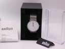 Front view of the Braun BN0031WHSLMHL watch in its original black box, accompanied by the user manual and hang tag.