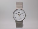 Front view of the Braun BN0031WHSLMHL watch with a clean white dial, black Arabic numerals, and a silver mesh bracelet.