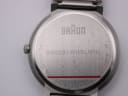Close-up of the watch's case back, clearly engraved with "Braun", model number "BN0031WHSLMHL", "All stainless steel", and "Water resistant 5ATM".