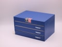 Original Tissot blue presentation box, closed, showing the Tissot logo and drawer design.