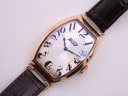 Overhead view of the Tissot T128509 A watch, showcasing the dial and brown leather strap.