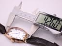 Digital caliper measuring the case length of the Tissot watch at 42.60mm.