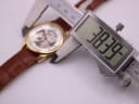 Digital caliper measuring the case diameter of the PWC London watch, displaying a precise measurement of 38.39mm
