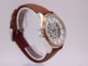 Left-side view of the Rotary watch, highlighting the polished stainless steel case.