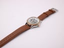 Top-down view of the Rotary watch with its brown leather strap extended.