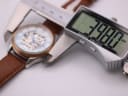 Digital caliper measuring the case diameter of the Rotary watch at 39.88mm.