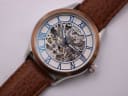 Close-up front view of the Rotary skeleton dial with blue Roman numerals and visible automatic movement.