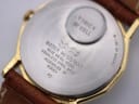 Extreme close-up of the watch case back, showing 'Timex W Cell', 'Assembled in Korea', and 'Water Resistant' text.