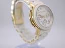 Left-side profile view of the Michael Kors watch case and white ceramic bracelet.