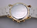 Rear view of the watch case back, showing "MICHAEL KORS", "ALL STAINLESS STEEL", "10 ATM", "MK-5145", and serial number.