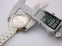 Digital caliper measuring the case diameter of the watch, displaying a precise reading of 38.7mm.