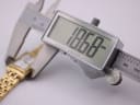 Digital caliper measuring the watch case horizontally, displaying an exact width of 19.68mm on its screen.