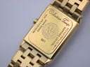 Close-up of the watch case back, detailing 'Collection Tango', model number 5971, serial K034970, 'Water Resistant 5ATM', and 'Sapphire Crystal'.