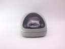 Front view of Seiko watch dial inside a grey plastic display pod.