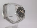 Another angled side view of the Seiko watch, highlighting the case profile and bracelet links.