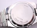 Close-up of the stainless steel case back with "Seiko", "Water Resistant", "Stainless Steel", serial number, and model number engravings.