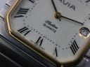 Detailed close-up of the AVIA Flatline dial, focusing on the Roman numeral VI, gold-tone minute track dots, and "ETA SWISS QUARTZ" text.