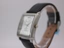 Angled side view of the Giorgio Armani watch, showing the polished silver-tone case and crown.