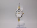 Front view of the Michel Herbelin 7003 watch with oval silver-tone case, gold-tone accents, and cream mother-of-pearl dial.