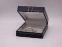 The Michel Herbelin watch displayed open in a dark blue presentation box with gold detailing.