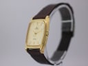 Angled side view of the Lorus watch, highlighting the profile of the gold-tone rectangular case and the textured brown leather strap.