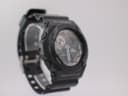 Three-quarter view of black G-SHOCK GA-300 watch from the left, showing side buttons and 'MODE' label on the bezel.