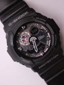 Close-up top-down view of the G-SHOCK GA-300 dial, showing the ana-digi display, visible gear-like elements, and red accents.