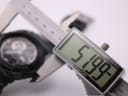 Digital caliper measuring the case diameter of the G-SHOCK GA-300, displaying an exact measurement of 51.99mm.