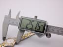 Digital caliper precisely measuring the watch case diameter, displaying 25.15 mm.