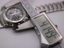 Digital caliper measuring the case diameter as 41.44mm, with the Seiko watch in the background.
