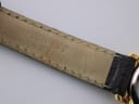 Underside of the black leather watch strap, showing the embossed "TISSOT 1853" branding.