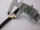 Digital caliper measuring the case diameter of the Tissot watch at 24.07mm.