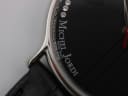 Extreme close-up of the dial edge and lug area, showing case finish and strap attachment.