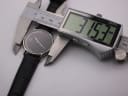 Digital caliper measuring the case diameter of the Michel Jordi watch, displaying 31.53mm.