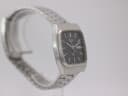Left side view of the Seiko watch, highlighting the integrated bracelet and case profile.