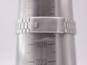 Close-up of the Seiko watch steel bracelet clasp on a wrist sizing gauge, showing a wrist circumference of 198mm.
