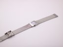 Full view of the Tissot L610K watch laid flat, showcasing the entire stainless steel mesh bracelet and clasp.