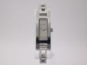 Front view of the Gucci 3900 L watch with a silver rectangular dial and integrated steel bracelet on a white background.